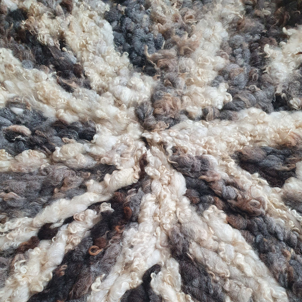 Round textured mixed romney wool rug
