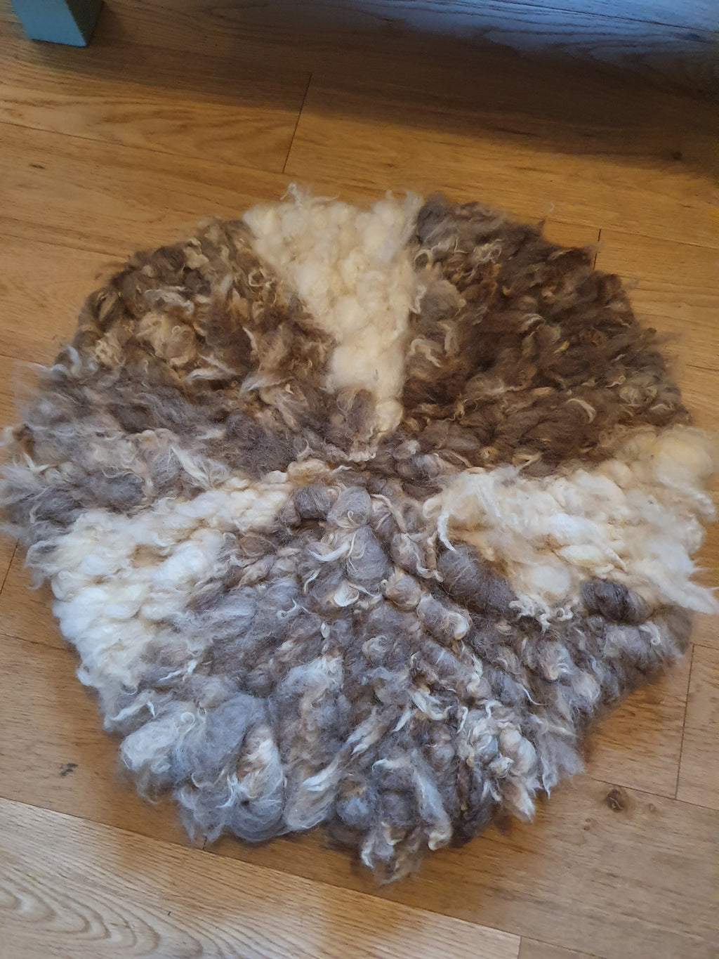Small round mixed romney wool rug
